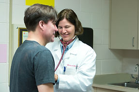 Volunteer medical professional with a patient