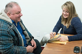 Social services volunteer meeting with clients