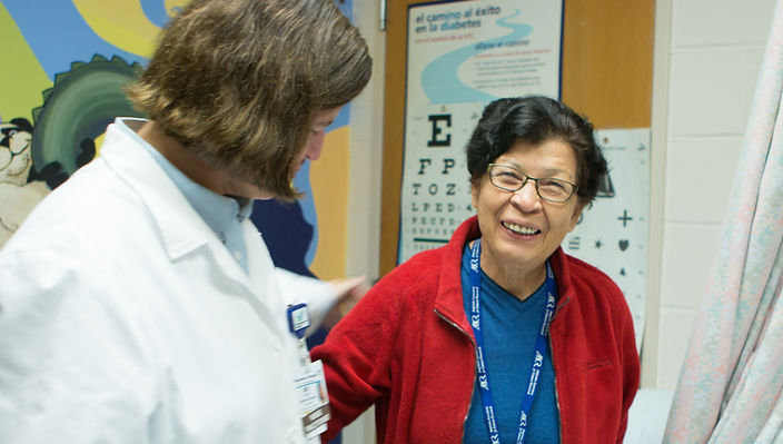 Clinician caring for a patient at Ann Silverman Community Health Clinic
